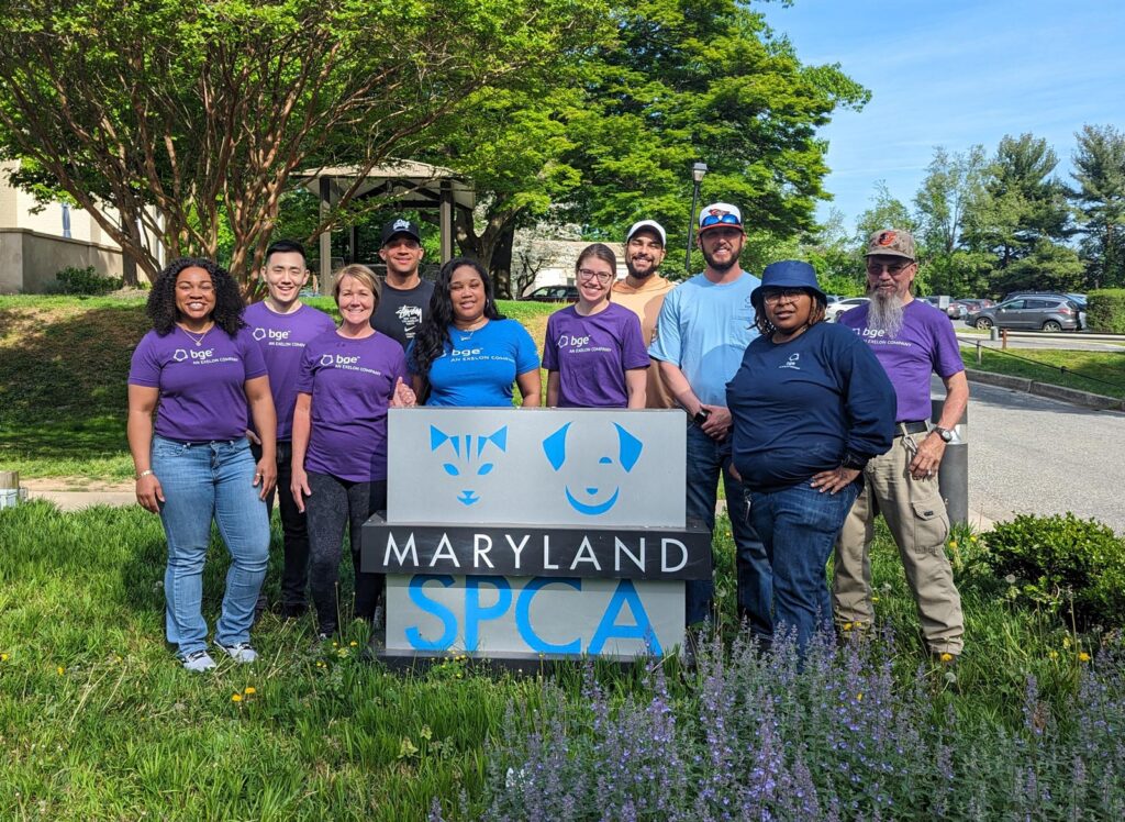 BGE Volunteers standing with Maryland SPCA sign